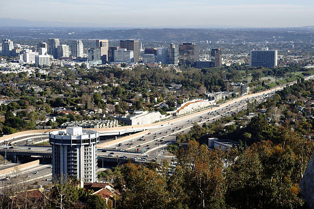 San Diego Freeway Los Angeles Los Angeles, United States - December 27, 2015: The skyline of Los Angeles with different skyscrapers behind the San Diego Freeway on December 27, 2015 in Los Angeles. san diego freeway stock pictures, royalty-free photos & images