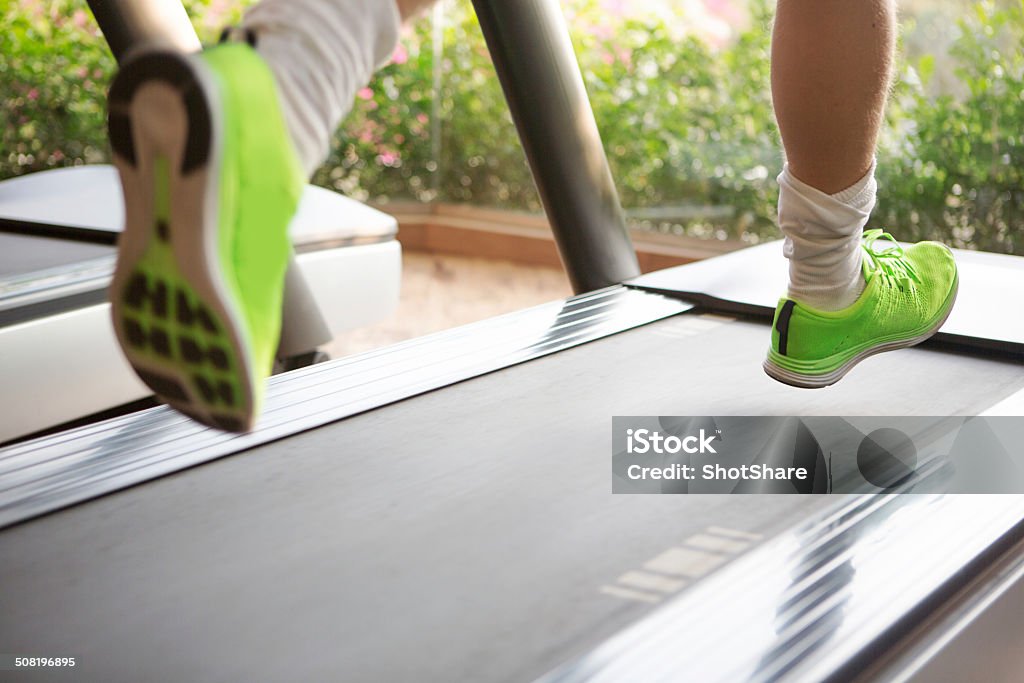 Gym Male running on treadmill, selective focus Activity Stock Photo