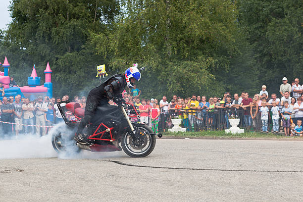 Sofia, Bulgaria - 18 August 2019: Two motorbikes burn wheels on a race track. White smoke.
