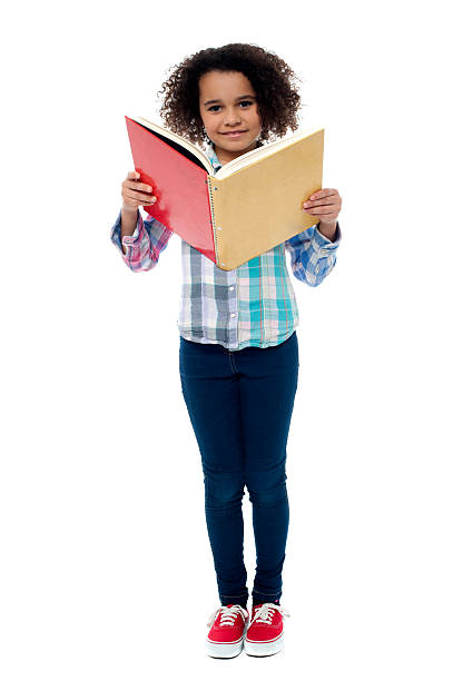 istock School girl a reading book 508197907
