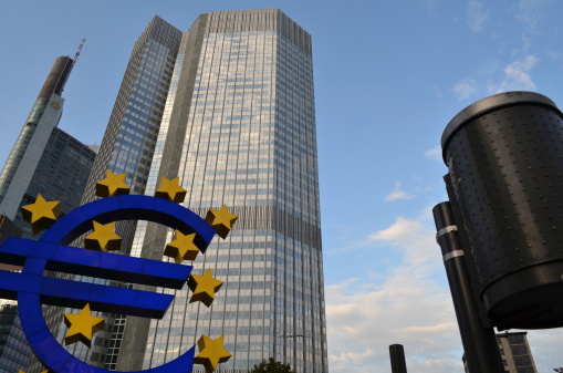 Frankfurt, Hessen, Germany – August 21, 2011: European Central Bank and Kommerz Bank buildings, Euro symbol and Trash Bin. Financial district, Frankfurt, Germany.