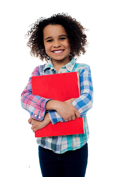 istock Smiling schoolgirl holding a book 508201403