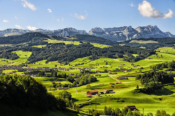beautiful and typical patchwork landscape in Appenzell, Switzerland wonderful summer day in Switzerland, in the background mount Säntis and Aplstein appenzell stock pictures, royalty-free photos & images