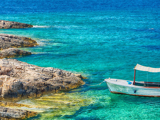 Boat on crystal clear water. The photo was taken on the Ionian island of Kefalonia in Greece