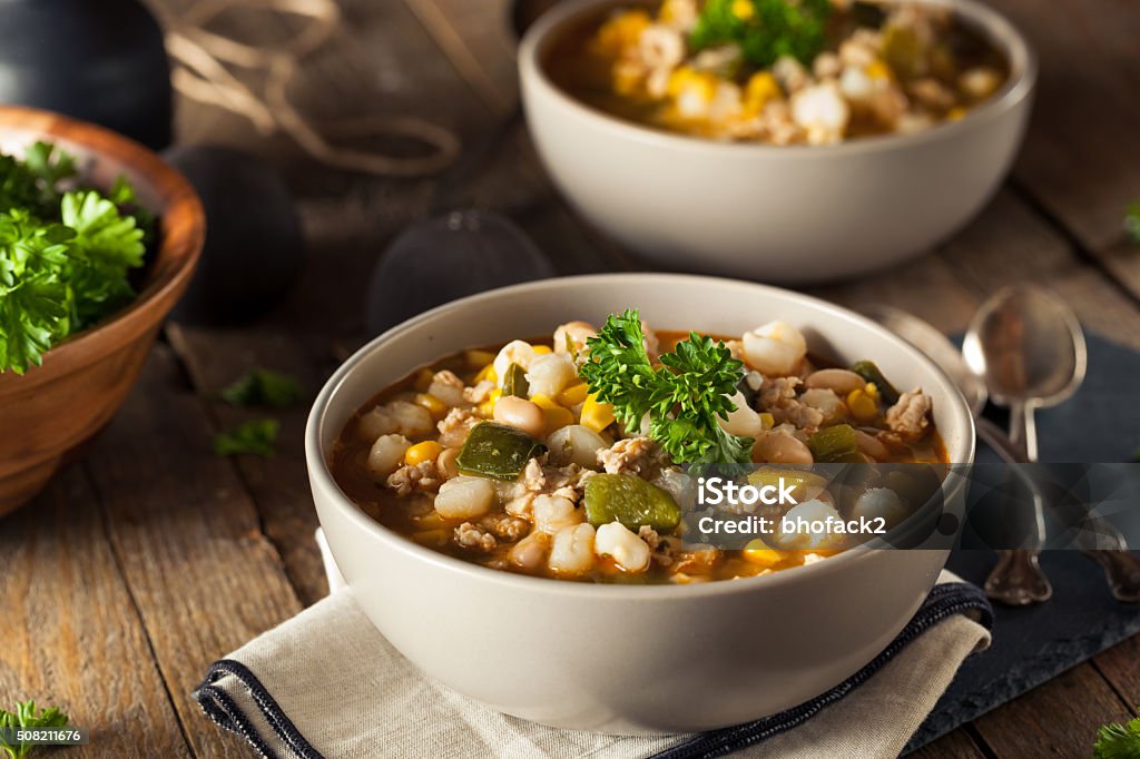 Hot Homemade White Bean Chicken Chili Hot Homemade White Bean Chicken Chili with Peppers and Corn White Color Stock Photo