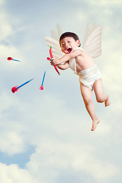 boy cupid with a bow and arrows  fly in the sky