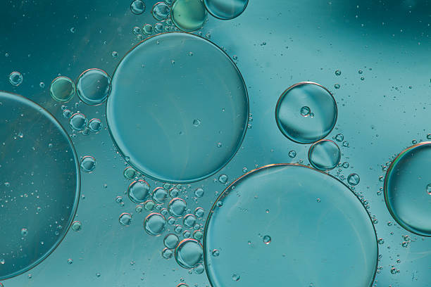 istock Abstract pattern of colored oil bubbles on water 508211945