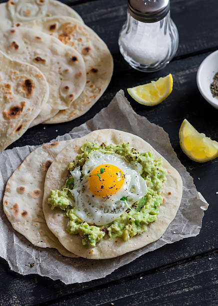 istock Homemade tortilla with mashed avocado and a fried quail egg 508212186