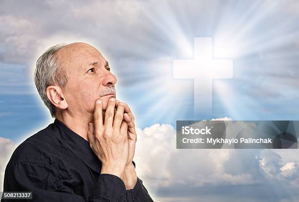 Elderly Man Praying Stock Photo - Download Image Now - Adult, Blue, Christianity