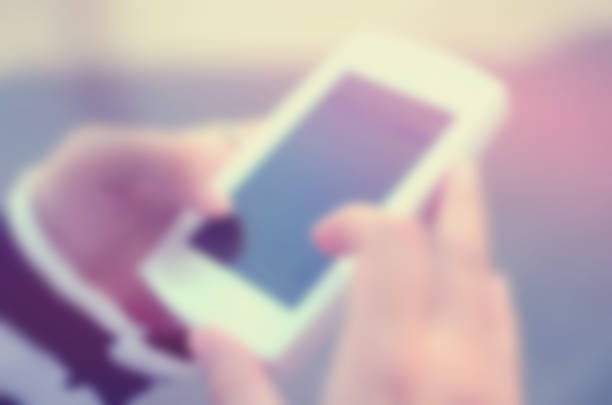 istock Blur woman hand using smart phone abstract background. 508214028