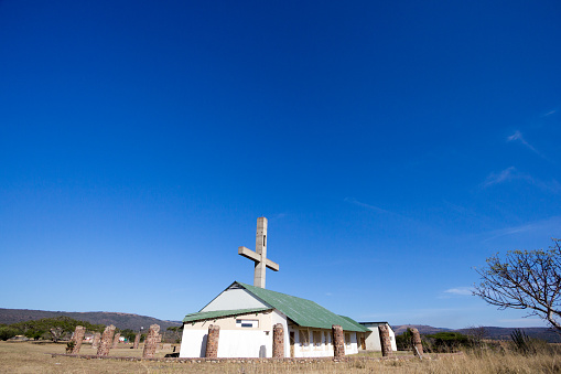 Old abandoned and dilapidated  church building in the Karoo region of South Africa.  Paint peeling of the walls the roof is rusting.
