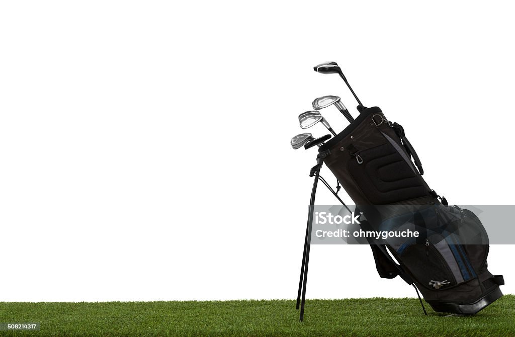 Golf bag and clubs on grass isolated on white Golf bag and clubs on grass side view isolated on white Golf Bag Stock Photo
