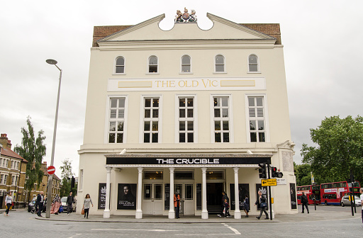 London, UK - June 16, 2014:  Facade of the historic Old Vic Theatre in Lambeth, South London.  The theatre is showing a highly regarded production of The Crucible by Arthur Miller.