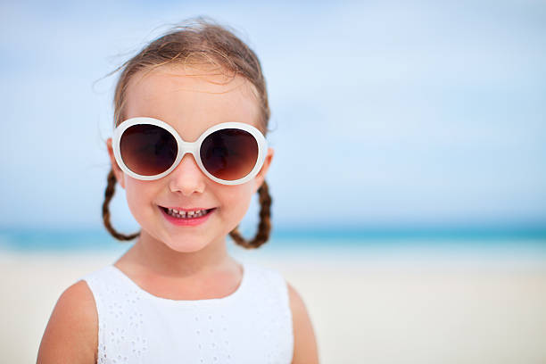 istock Adorable little girl at beach 508214413