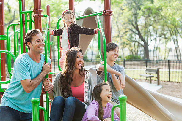 istock Mixed race family at park 508215467