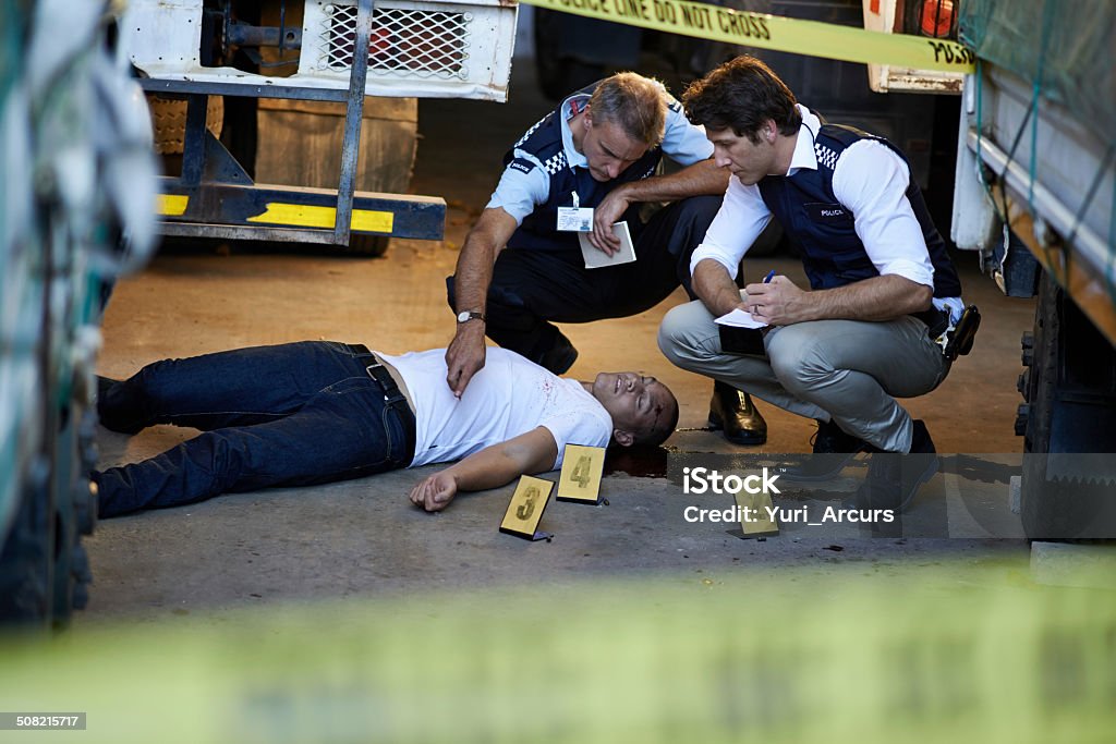 The crime scene evidience is essential Shot of policeman investigating a murder scenehttp://195.154.178.81/DATA/shoots/ic_783946.jpg Murder Victim Stock Photo
