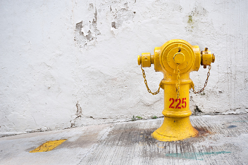 HONG KONG - FEB 11, 2013 - Yellow fire hydrant, Hong Kong. The yellow colour signifies a salt water source.