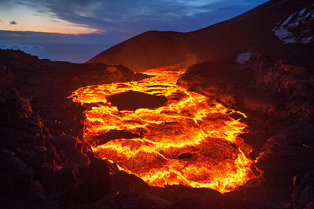 lava lake The lava lake of a volcanic eruption on Kamchatka brightly lit winter season rock stock pictures, royalty-free photos & images