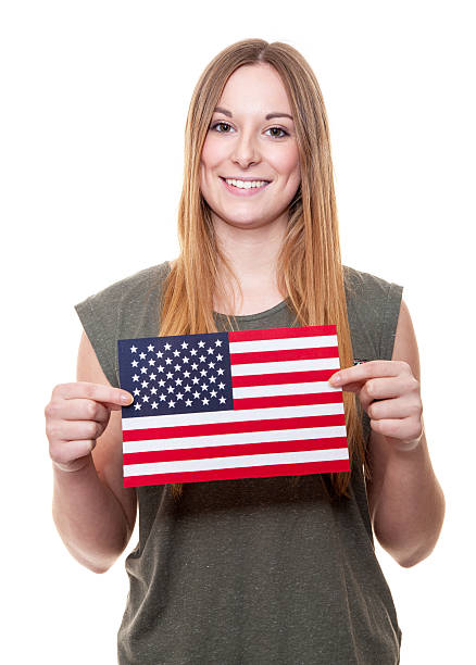 istock Young woman holding US flag 508218580