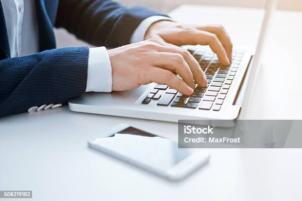 Businessman Using Laptop At The Office Closeup Image Stock Photo - Download Image Now