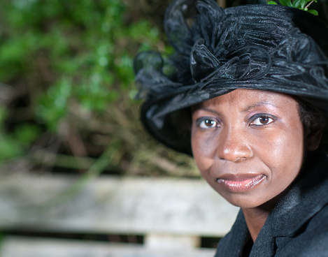 A Portrait Of An African American Woman In A Smart Black Hat. 
