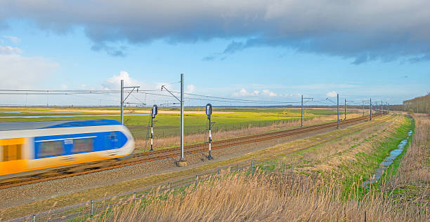istock Electric train riding through nature in winter 508220662