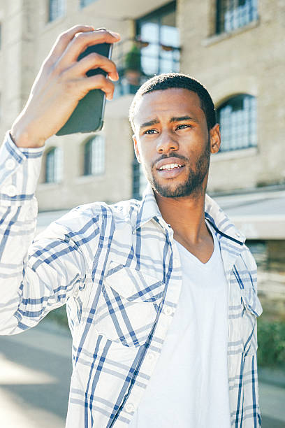 istock Young Man Taking Selfies With His Mobile Phone Outdoors 508222556