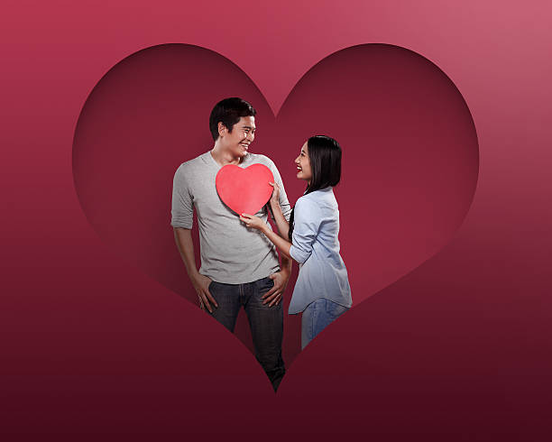 istock Lovely couple holding red heart 508223234