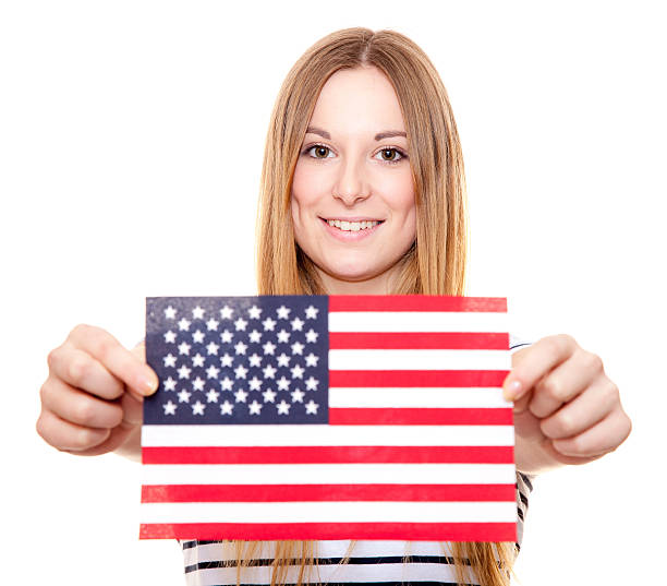 istock Young woman holding US flag 508224030
