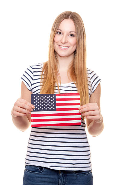 istock Young woman holding US flag 508224072