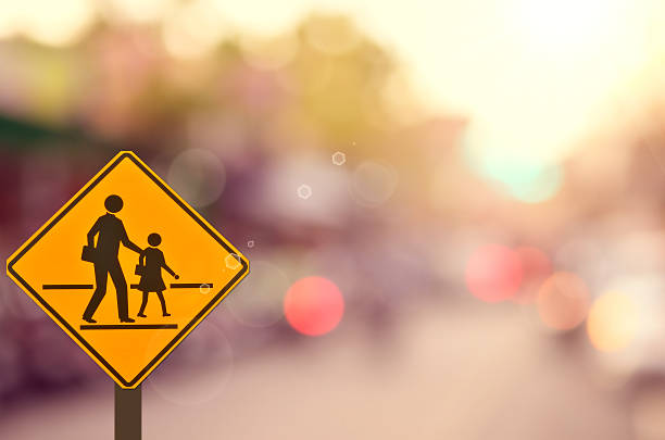 istock School sign on blur traffic road abstract background. 508224180