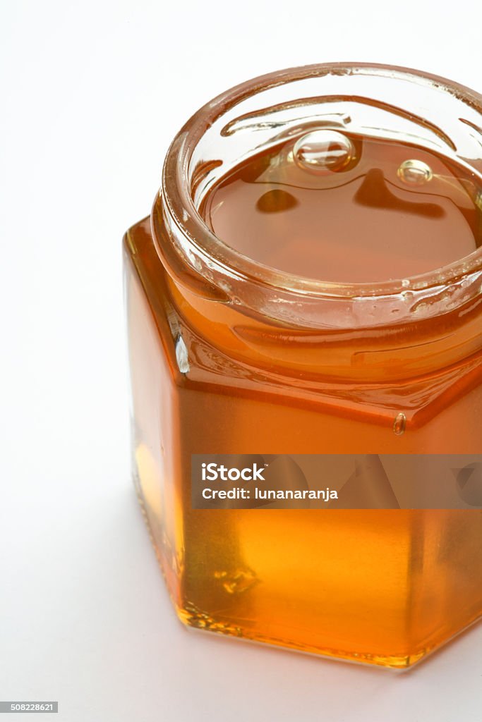 Honey jar Macro shoot os a honye jar with white background Ayurveda Stock Photo