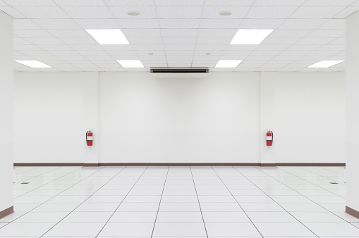 White empty room with tile floor.