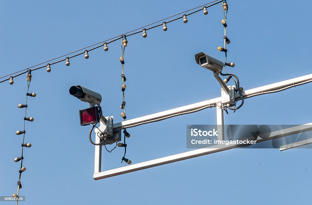 Road surveillance cameras Road surveillance speed cameras against blue sky Blue Stock Photo