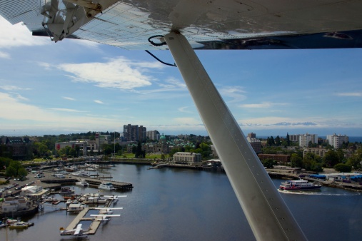 Victoria's Inner Harbour is shown from the eyes of a seaplane passenger (on a flight from Vancouver). The BC Parliament Buildings, Royal BC Museum and Robert Bateman Centre are visible.