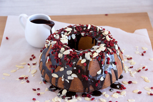 Ring Cake With Chocolate Sauce, Cranberry  and Flaked Almonds