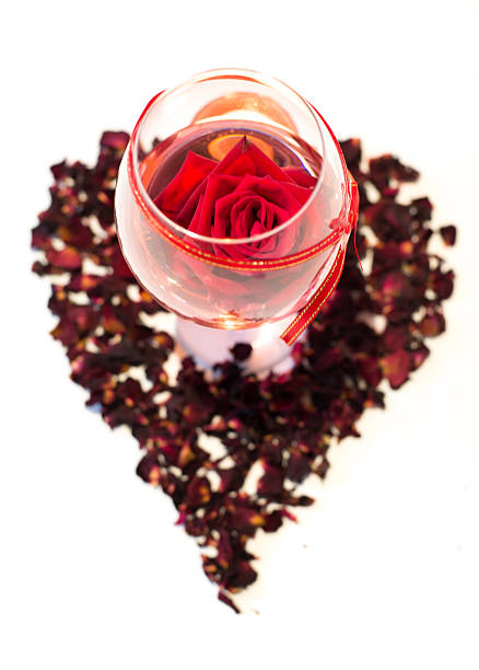 istock Red roses  in wine  glass on white background 508234655