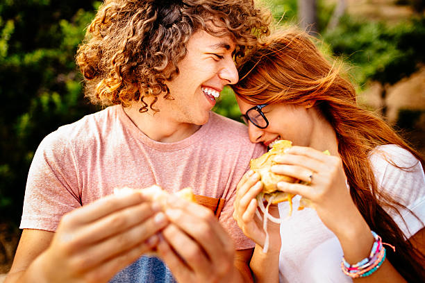 istock Couple Eating Burgers 508235431