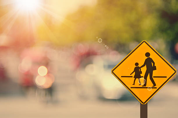 istock School sign on blur traffic road abstract background. 508247710