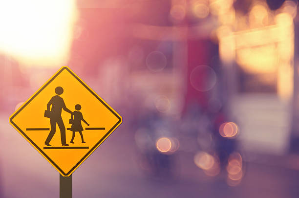 istock School sign on blur traffic road abstract background. 508247938