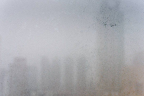 istock dropped of water on surface of window 508248328