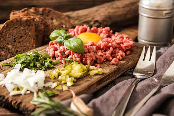 Photo of beer snack Beef tartare with pickled cucumber