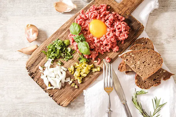 Photo of beer snack Beef tartare with pickled cucumber