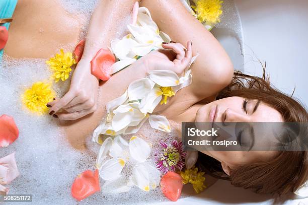Beautiful Sexy Young Woman Having Bath With Flower Petals Stock Photo - Download Image Now