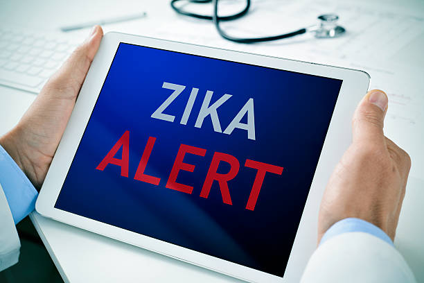 istock tablet with the text zika alert 508251198