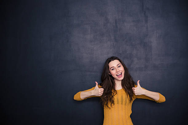 istock Cheerful woman showing thumbs up 508253570