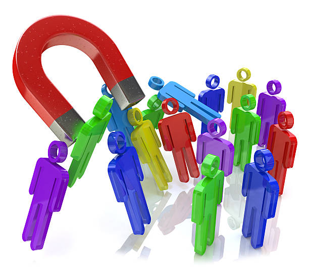 Social engineering concept: horseshoe magnet capturing crowd of Social engineering concept: horseshoe magnet capturing crowd of color human figures isolated on white background in the design of the information related to the concept of attracting new people number magnet stock pictures, royalty-free photos & images
