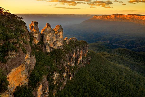 Sunrise in Blue Mountains View over the landmark rock formation "Three sisters" in Blue Mountains, NSW, Australia on sunrise.  rock formation photos stock pictures, royalty-free photos & images