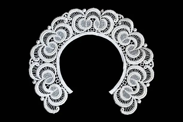 White lacy collar isolated over black