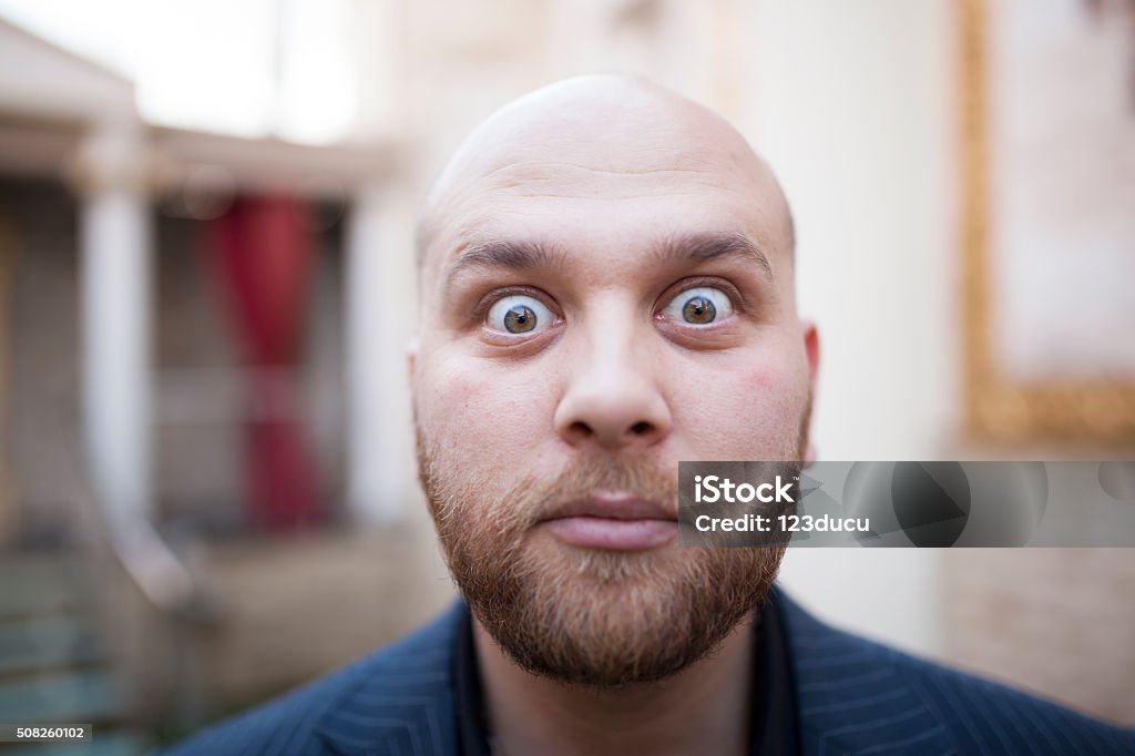 Big Eyes Portrait of shocked man have a big eyes Open Stock Photo